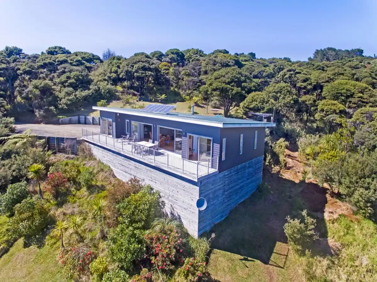 Aerial view of 175° East — three off-grid houses on 14 acres at Medlands Beach, Great Barrier Island