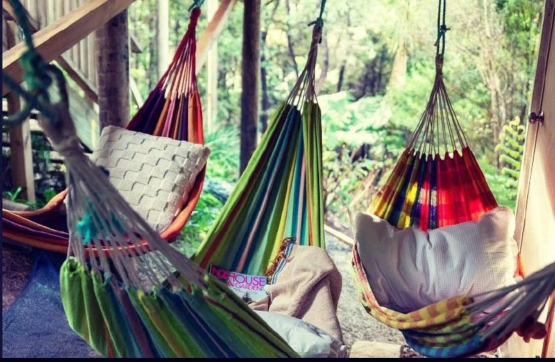 Colourful hammocks on the Tree House deck, Great Barrier Island