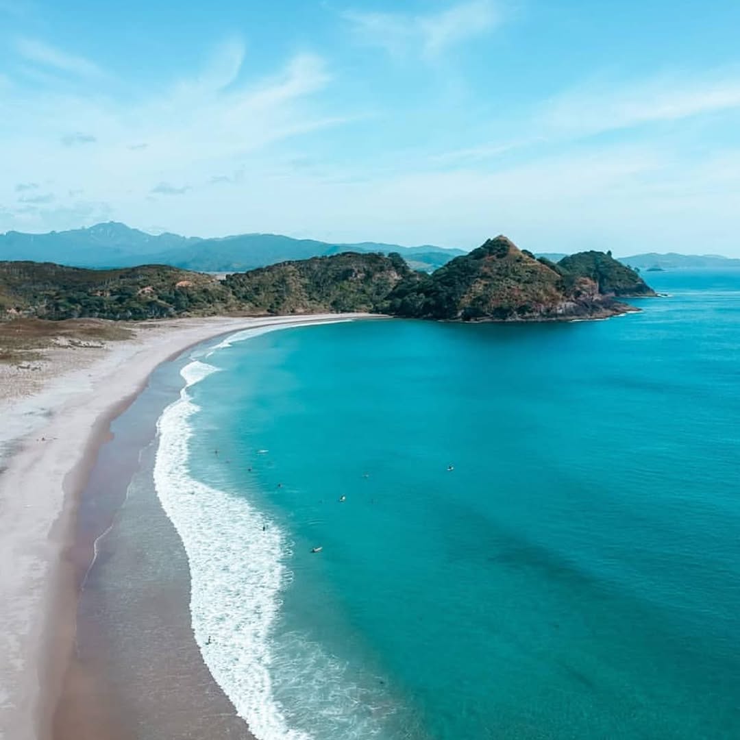 Medlands Beach from above — vast empty turquoise bay, Great Barrier Island