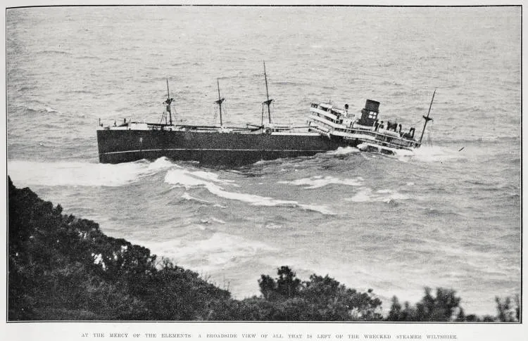 SS Wiltshire listing in heavy seas below the cliffs of Rosalie Bay, Great Barrier Island, in June 1922